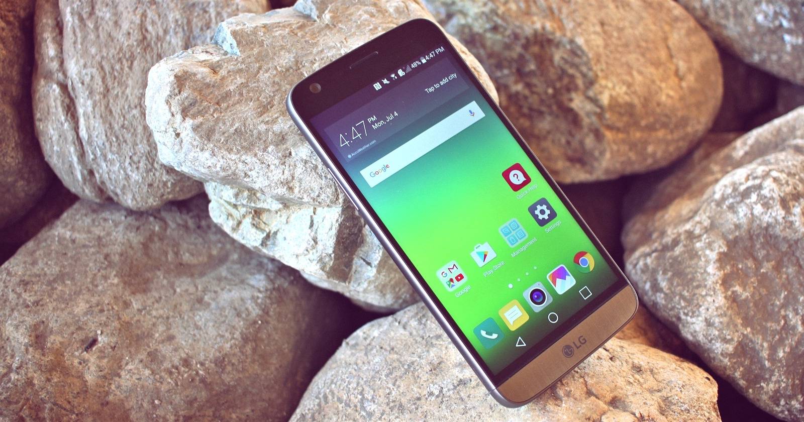 Android phone resting against rocks