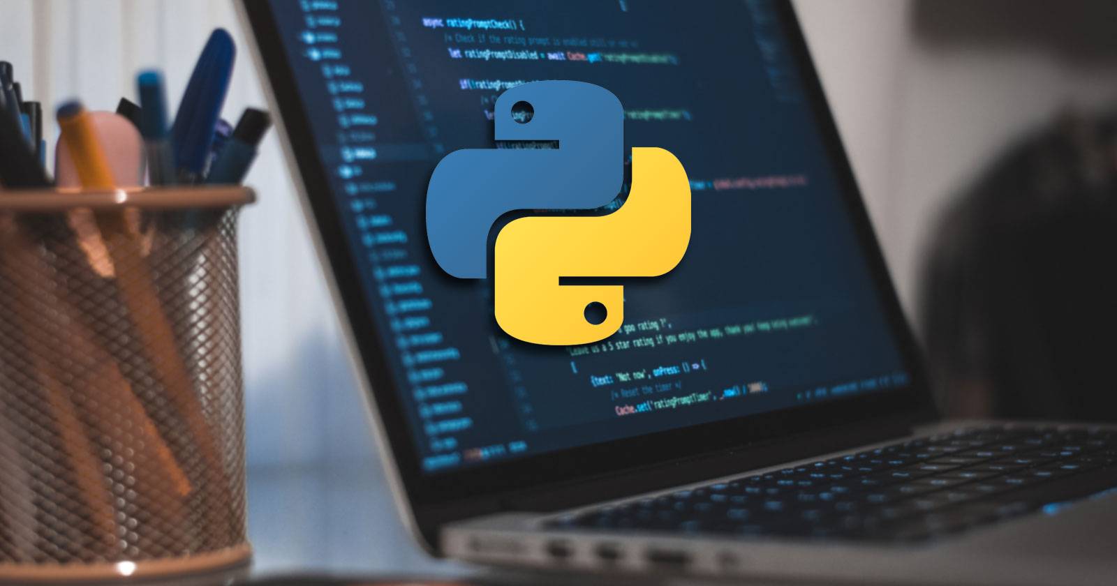 Python logo in front of a MacBook