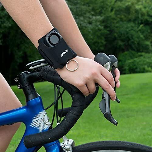 SABRE Personal Alarm for Runners on a wrist while cycling
