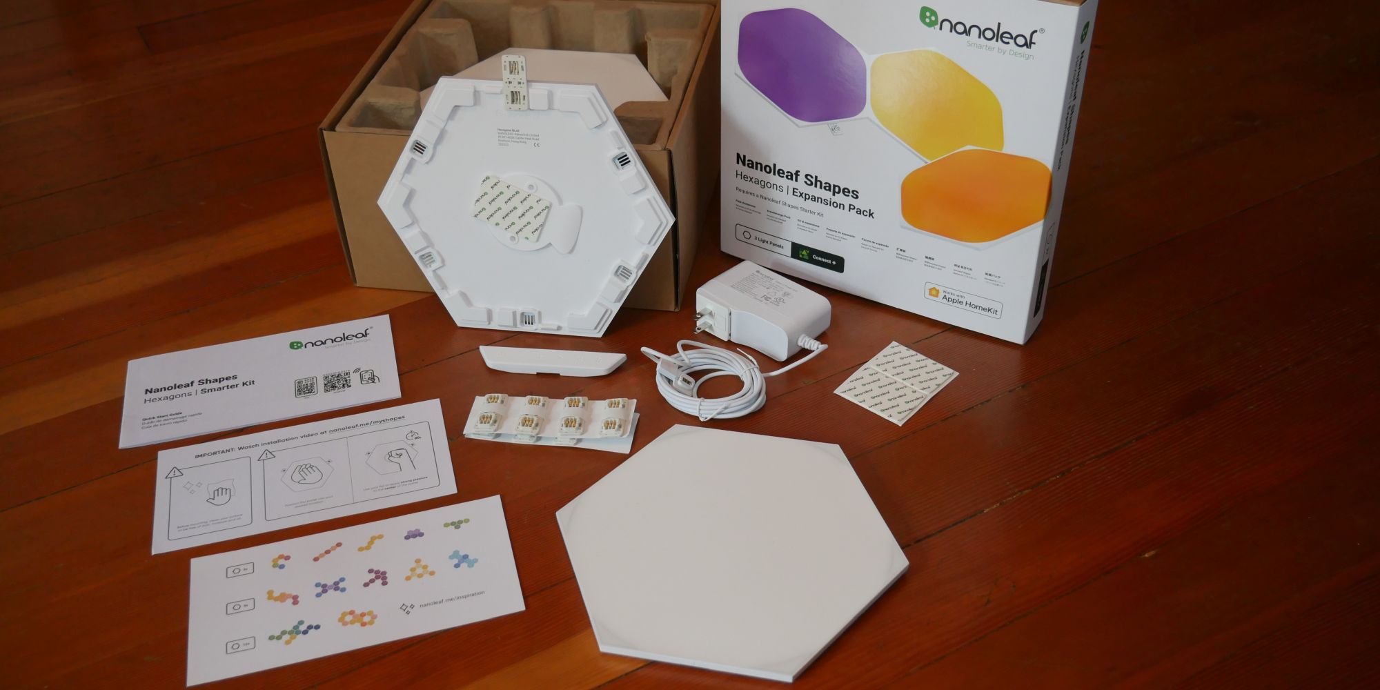 Nanoleaf Shapes Hexagons Smarter Kit unboxed and Expansion Pack next to it