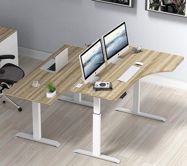 SHW L-Shaped Electric Height Adjustable Desk in a room