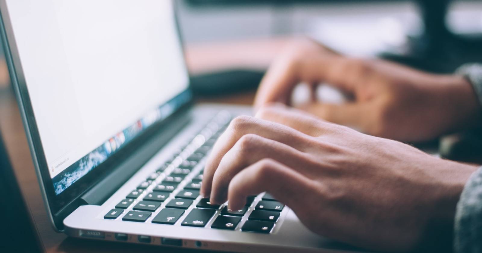 Person typing on a laptop