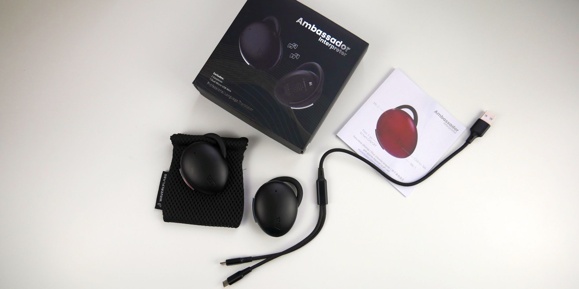 Waverly Labs Ambassador Interpreter package, manual, charging cable, carrying pouch, and both earpieces