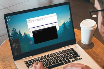 Windows user opening disk management on a laptop