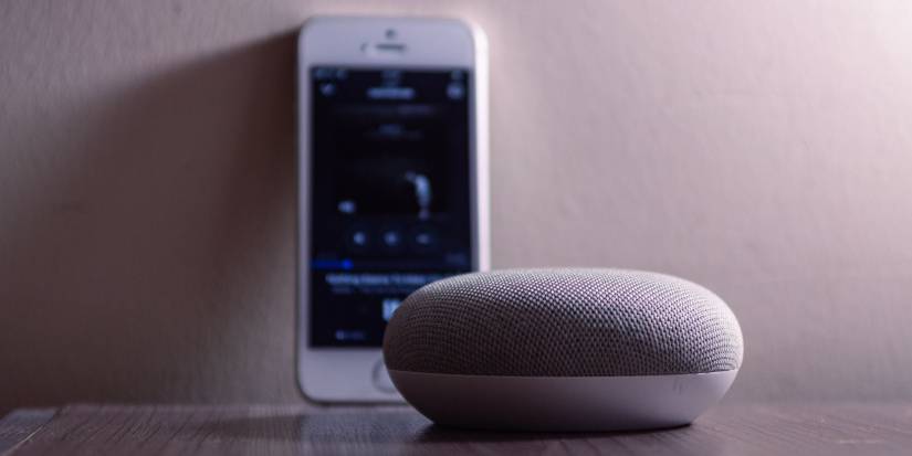 Google Home Mini next to iPhone
