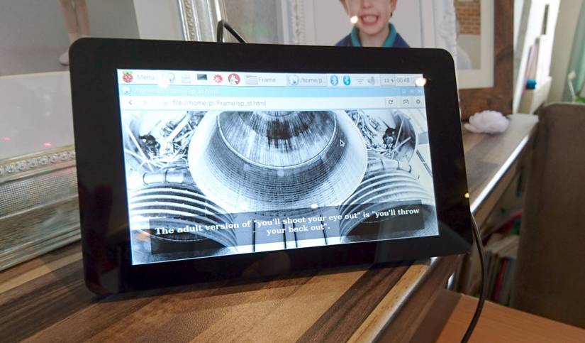 A digital photo frame on a shelf