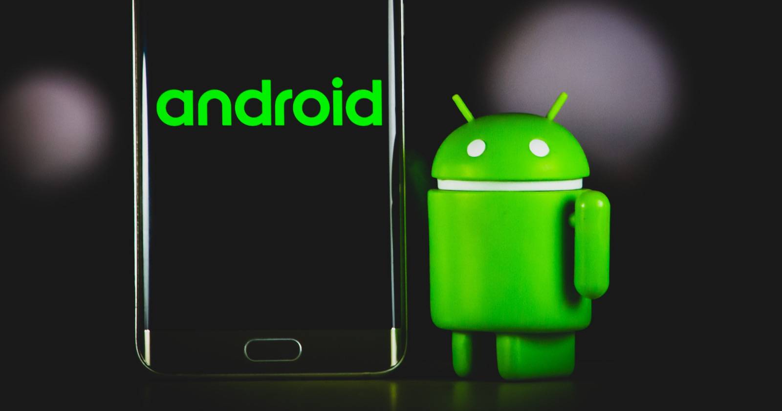 android logo on phone with android logo figure