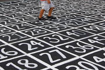 chalked number grid on ground