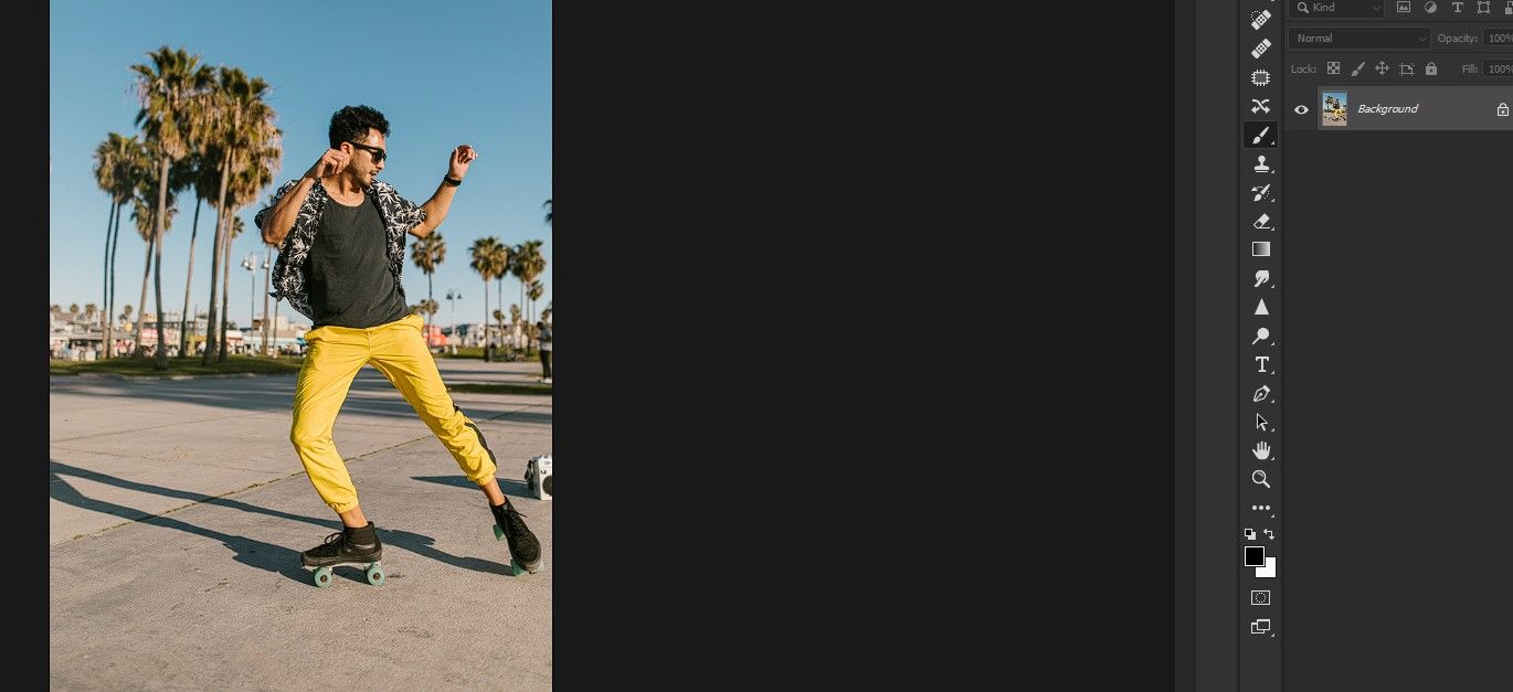 Rollerblader striking a pose on the street. 