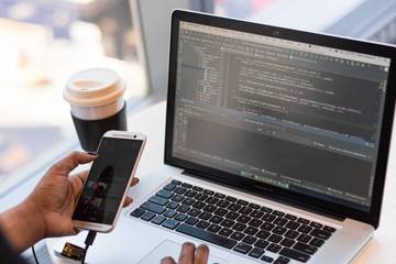 Photo of a person coding on their computer