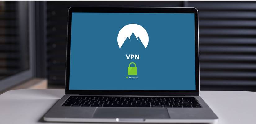 Computer on a table with VPN design on screen