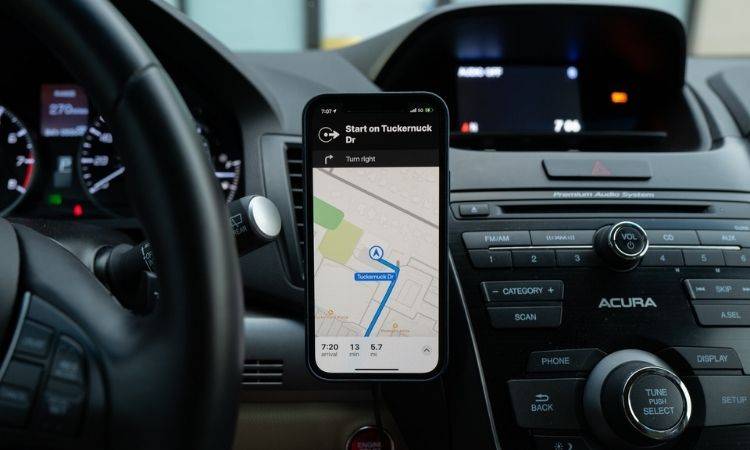 black-iPhone-docked in car with GPS directions