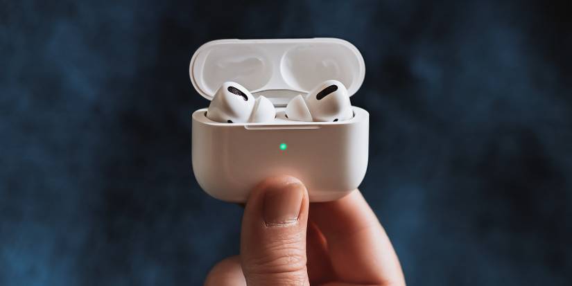 Person holding AirPods Pro