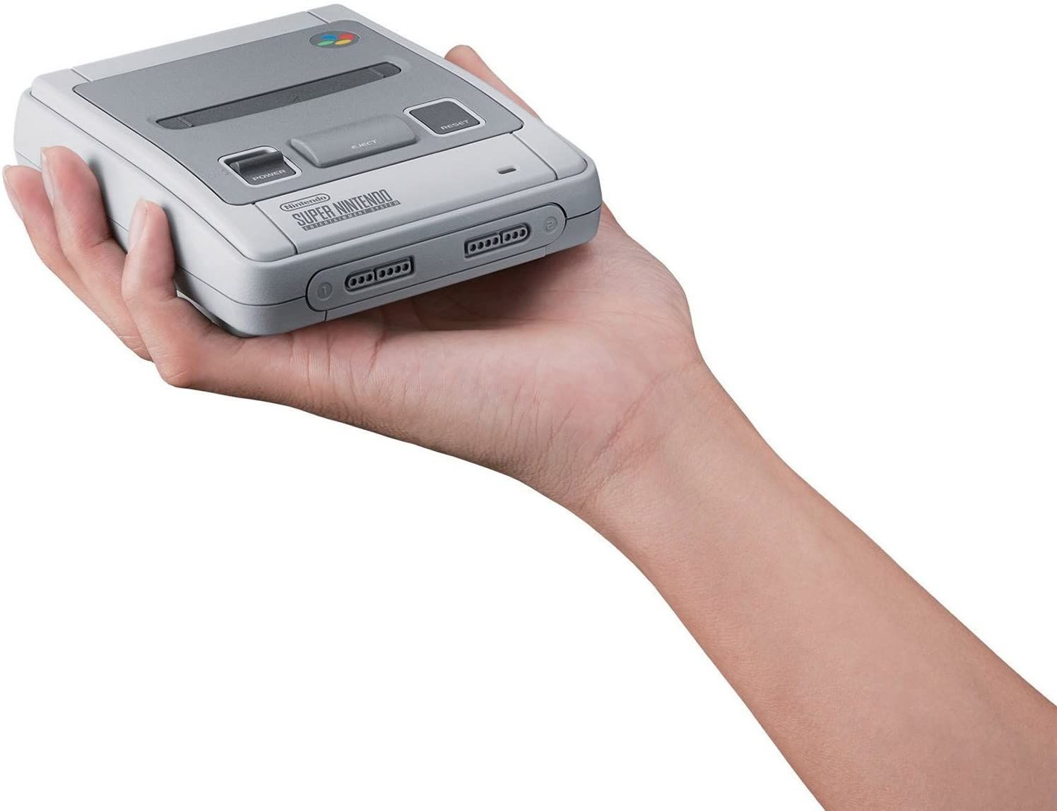 Super NES Classic being held upright