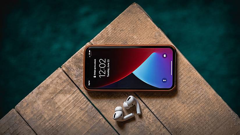 AirPods Pro with iPhone next to water