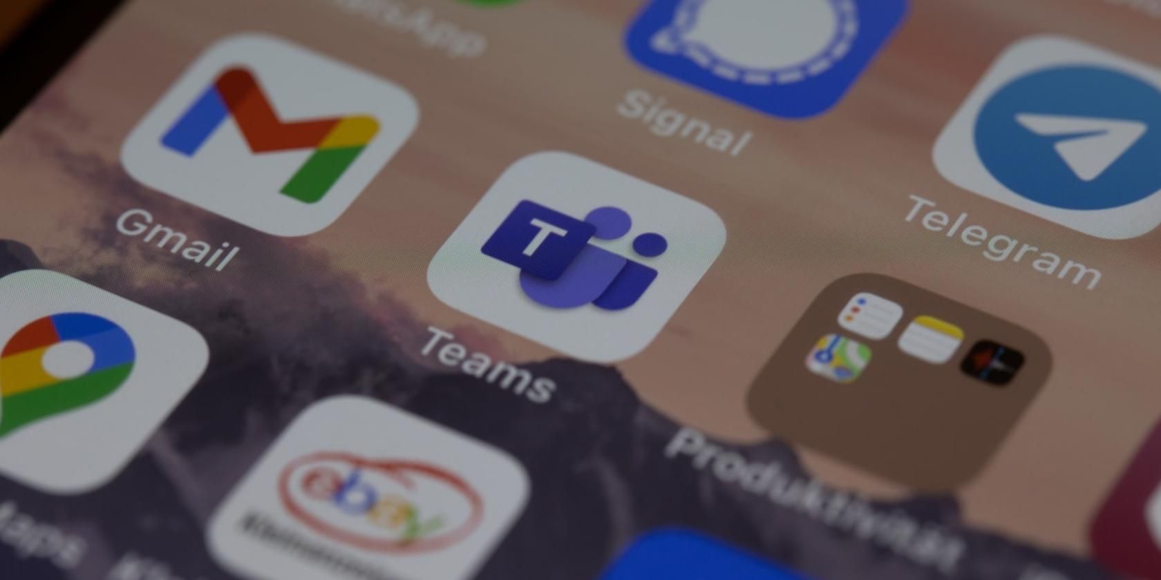 An image shows a phone screen with Microsoft Teams at the center. 