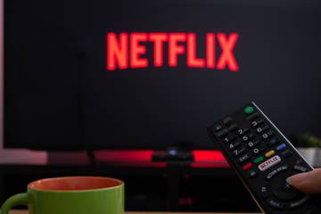 netflix logo on TV with remote in front