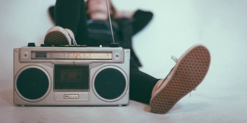 A person resting while listening to the radio