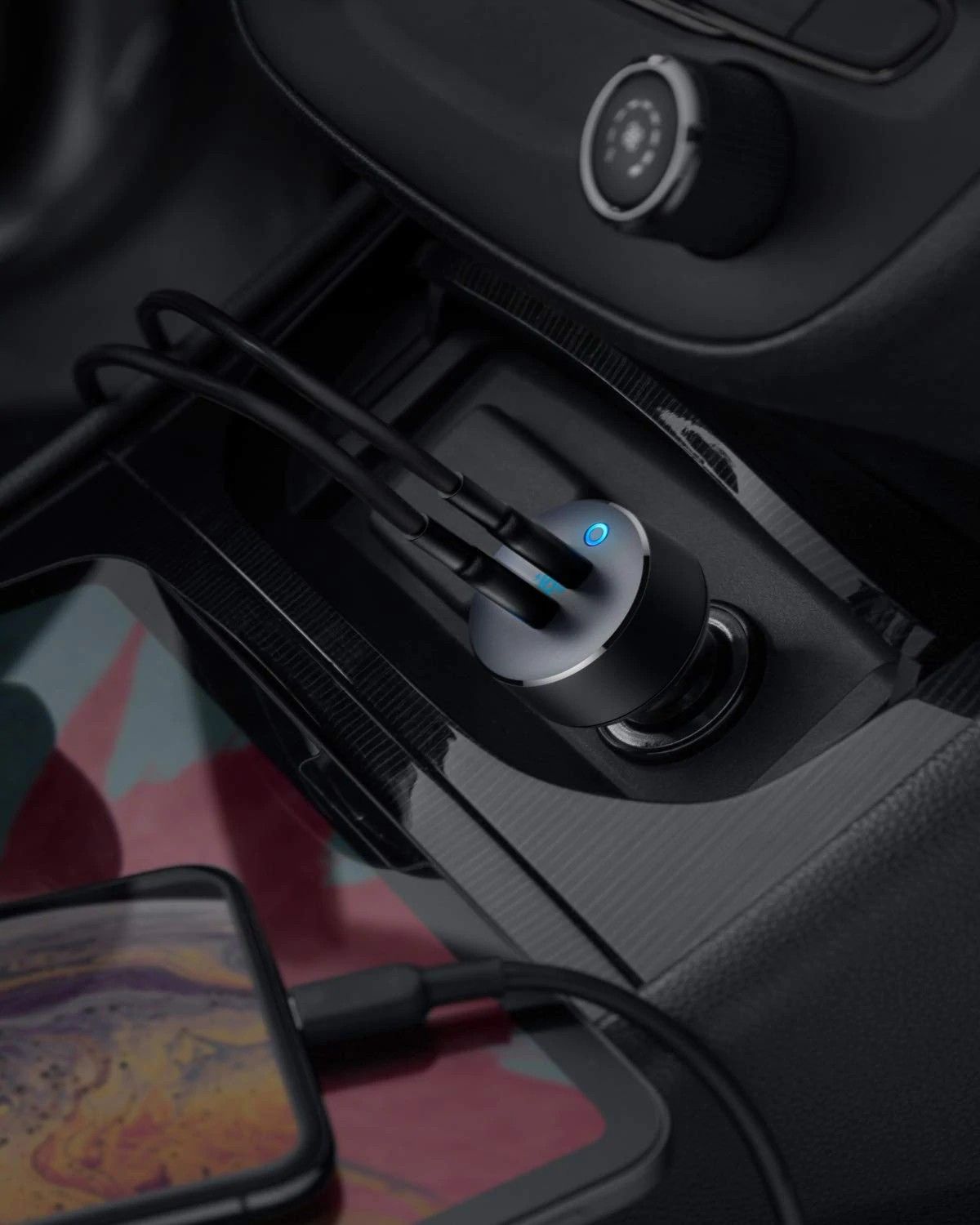 The Anker PowerDrive III Duo plugged into a car