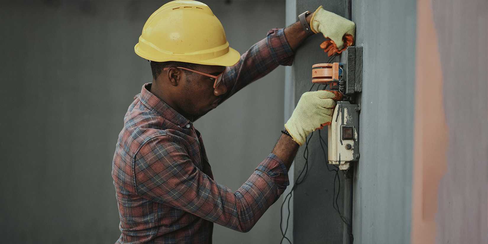 Professional Electrician Installing Wiring