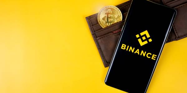 binance logo on smartphone with bitcoin in wallet feature