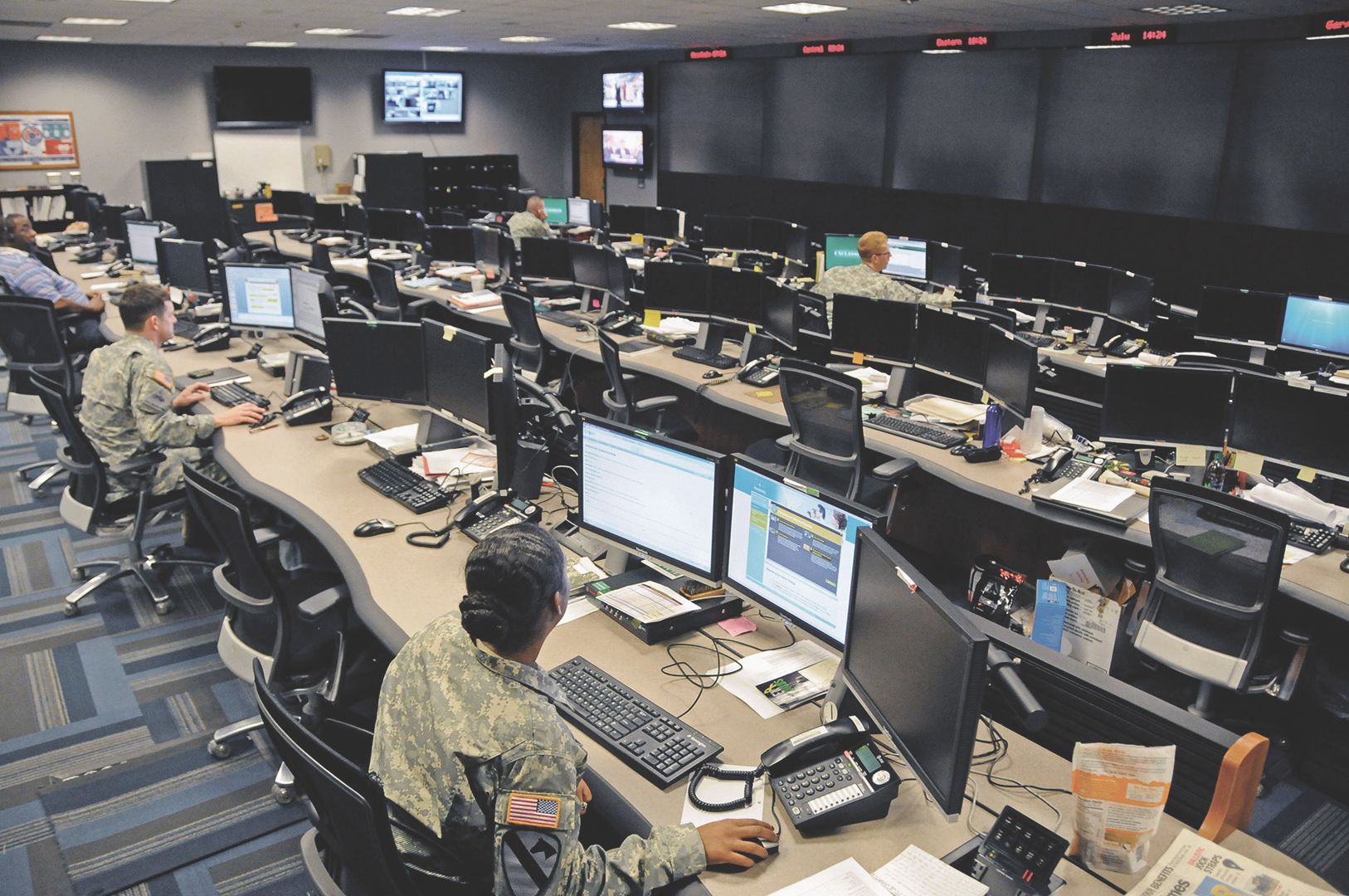 Cyber soldiers conducting operations in an office
