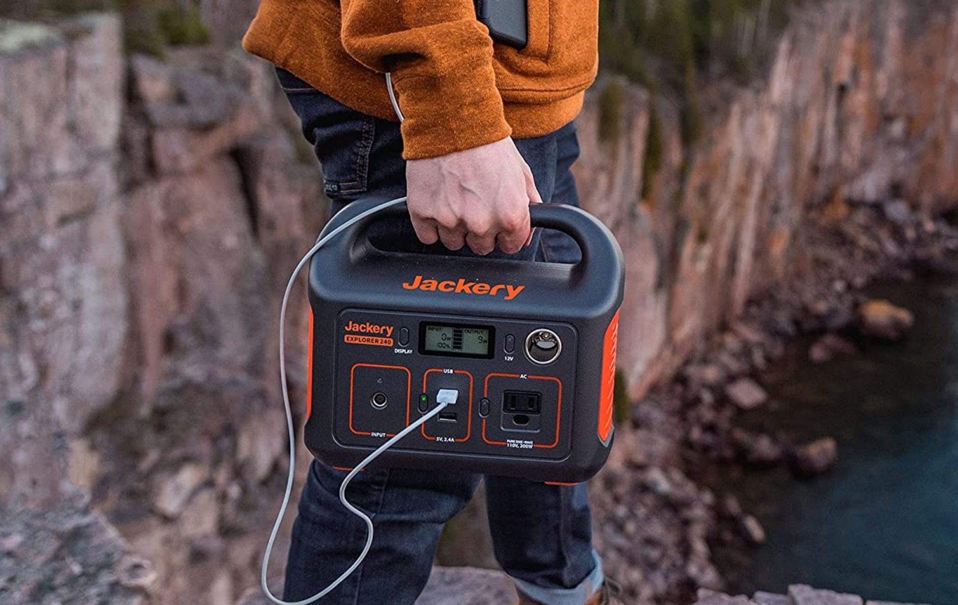 A Jackery Explorer 240 being carried