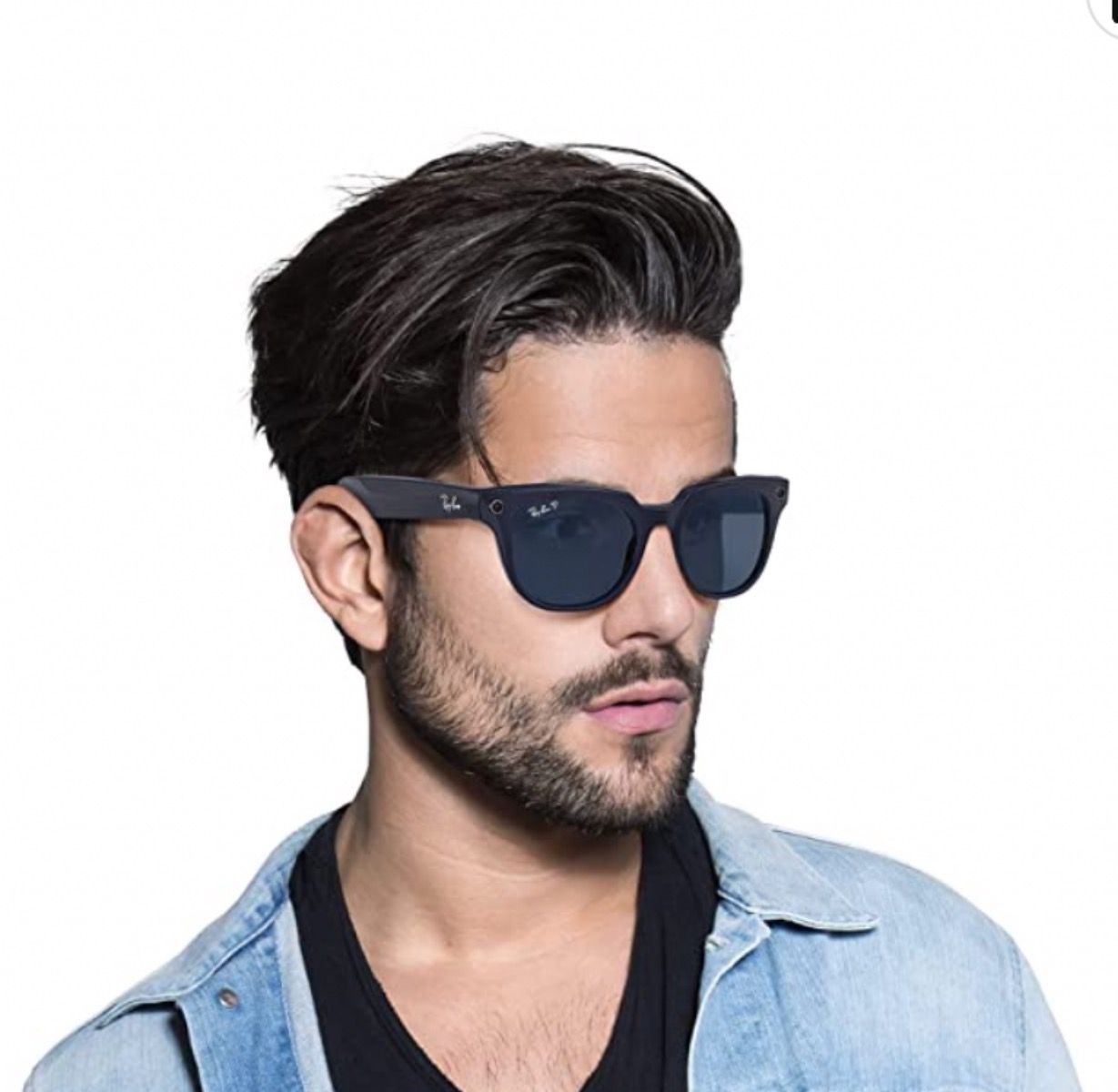 A pair of RayBan Stories Meteor Square sunglasses on a bearded man's face