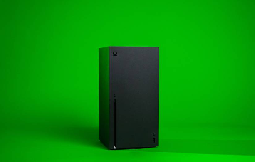 Xbox console in front of a green background