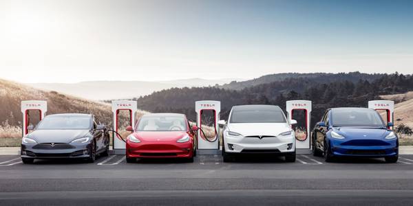 Teslas charging at superchargers