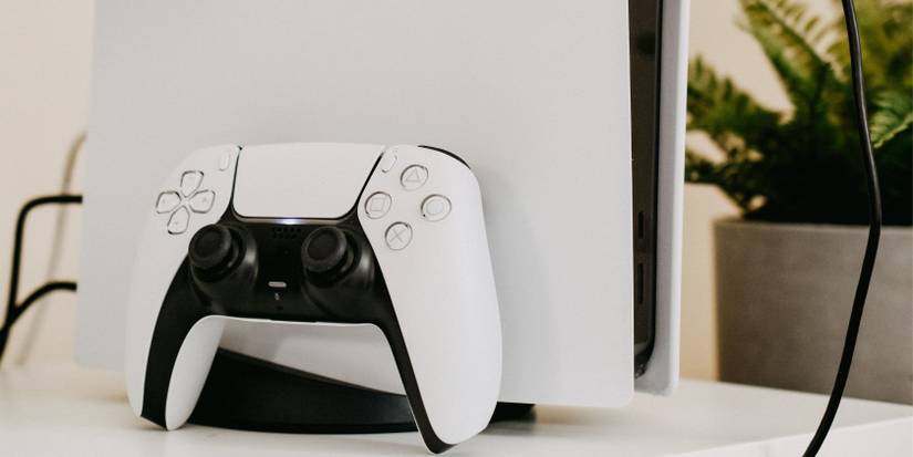 PS5 and DualSense in brightly lit room 