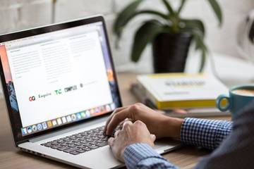Person typing at a laptop on a desk