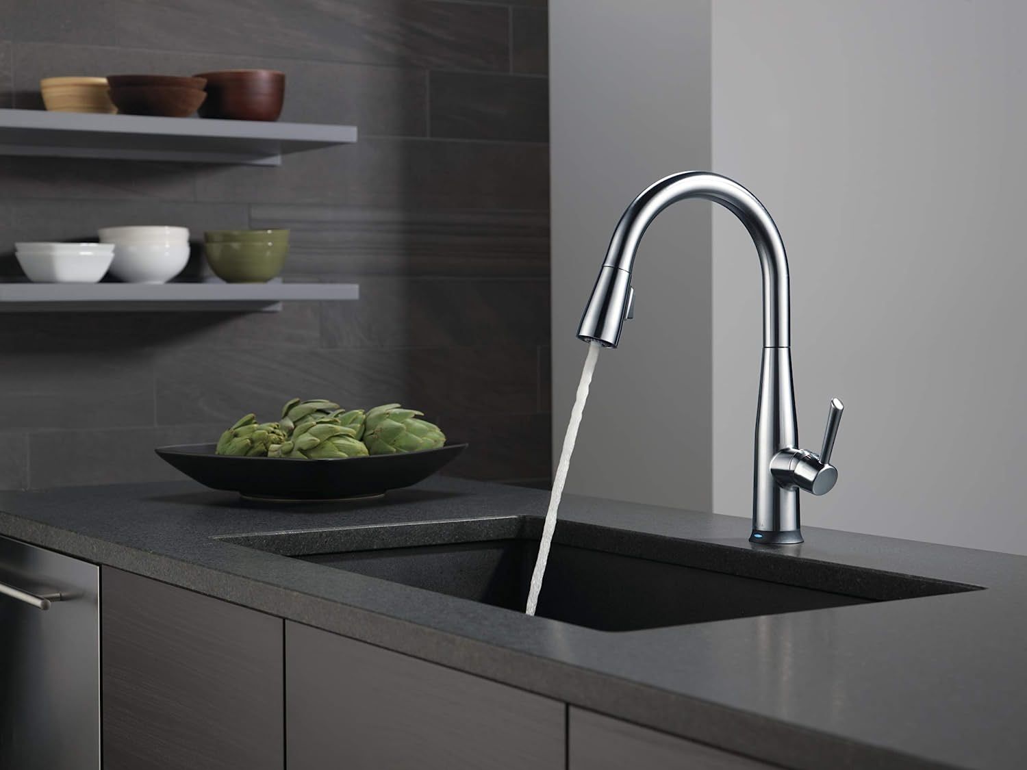delta faucet essa voiceiq kitchen faucet dispensing water into a sink