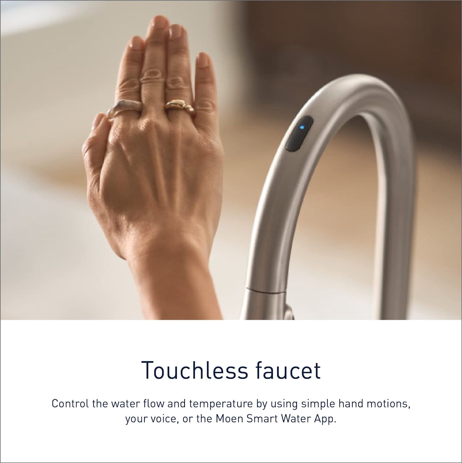 a hand activating the moen sleek smart faucet
