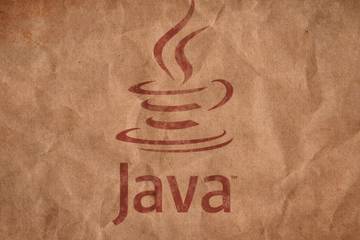 The Java logo sitting on a brown background image with a paper effect.