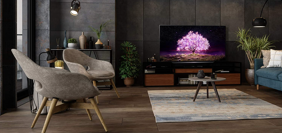 An LG C1 OLED 65-Inch TV in a living room with screen on