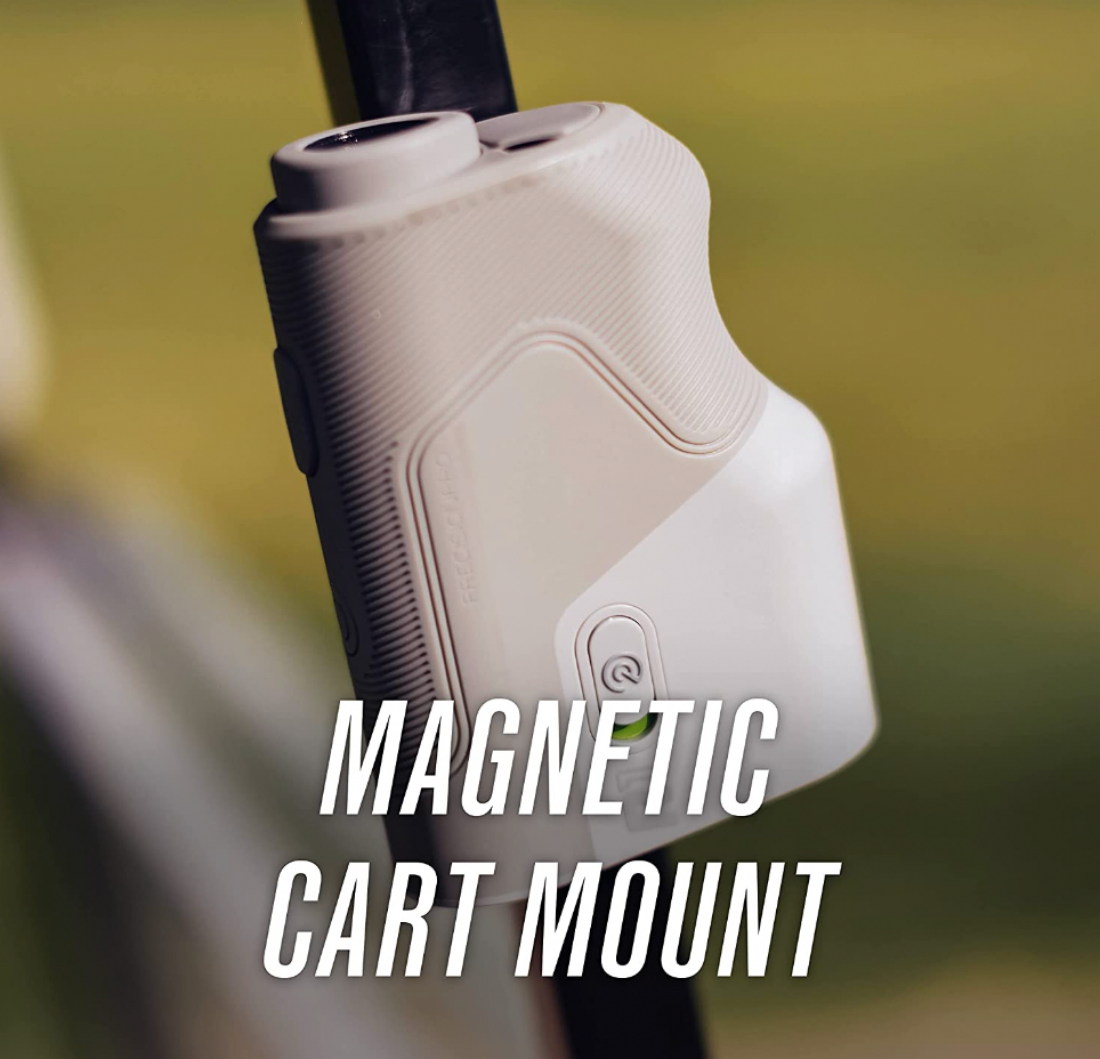 A Precision Pro R1 Smart Rangefinder magnetically attached to a golf cart
