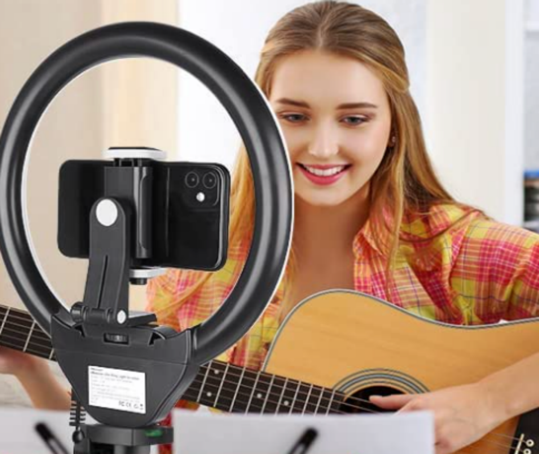 A shot of a female musician streaming while using a Sensyne 10'' Ring Light