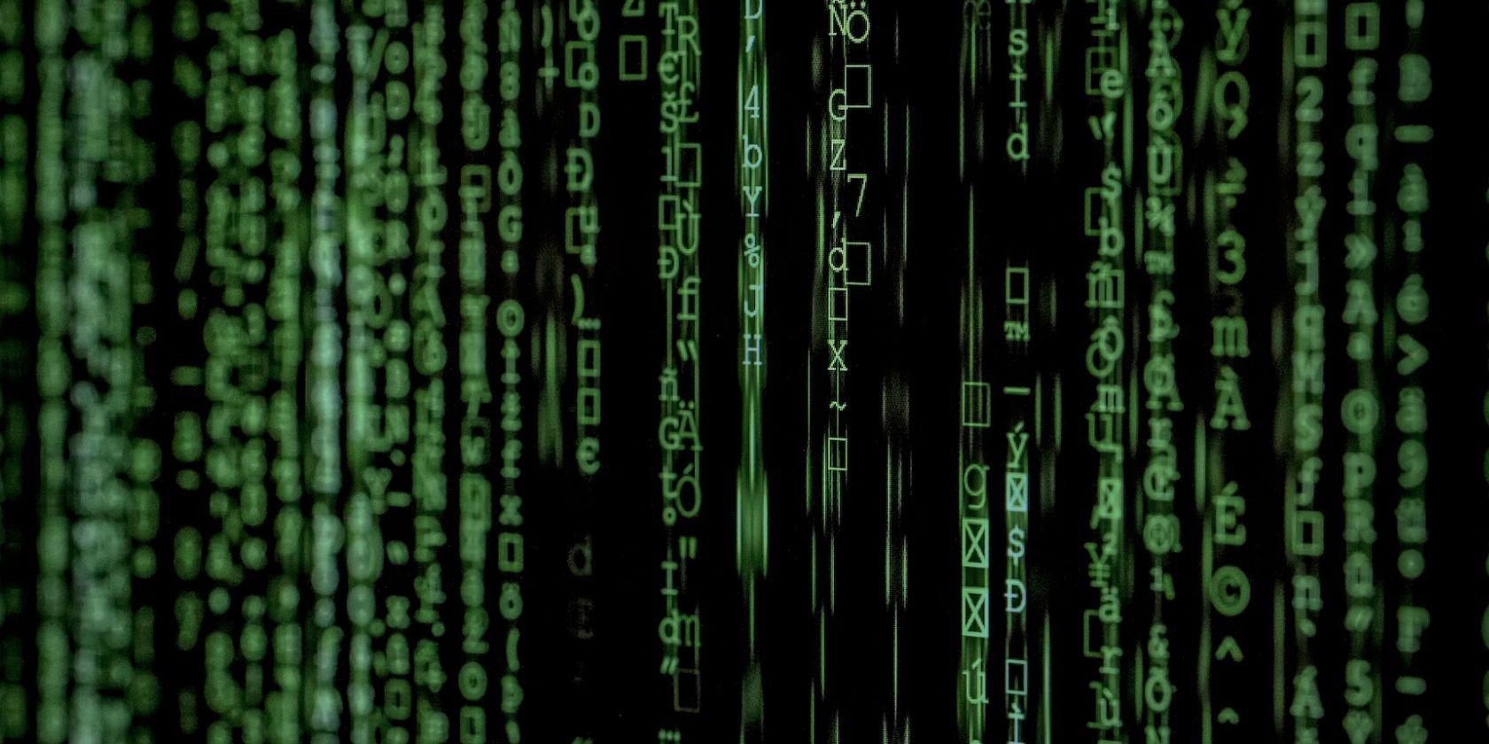 Random green characters fall down a screen on a black background