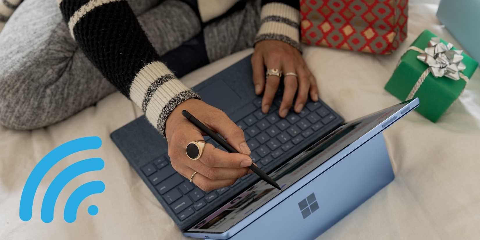 Person using Windows Laptop with the Wi-Fi icon Highlighted