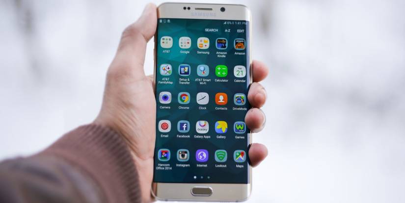 person holding smartphone in hand