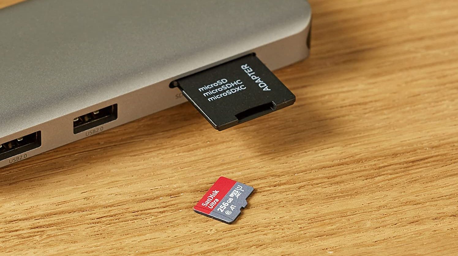 sandisk ultra next to microsd card adapter and external usb hub