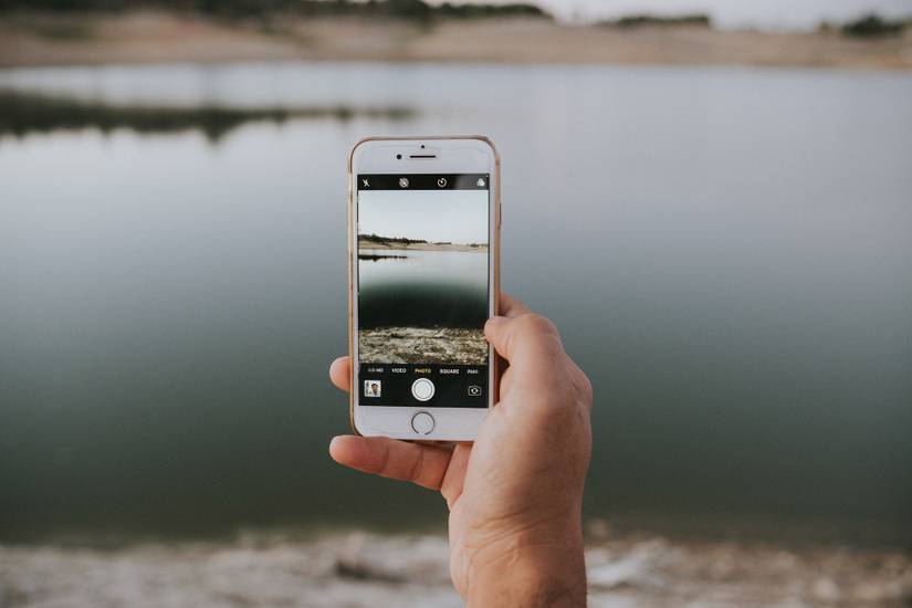 Man Taking Photo Using One Hand A Complete Guide to One-Handed Photography