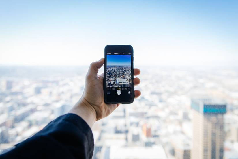Man Taking Photo Using One Hand A Complete Guide to One-Handed Photography