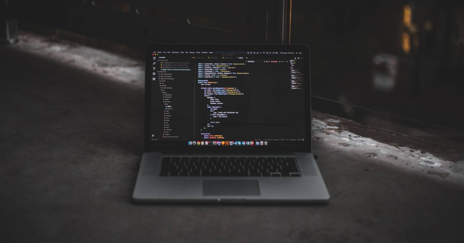 Code on laptop on ground