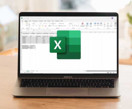 A Laptop Sitting On Top of a Wooden Table. An Excel Spreadsheet Is Blurred Out in the Background, and the Excel Logo is in the Foreground