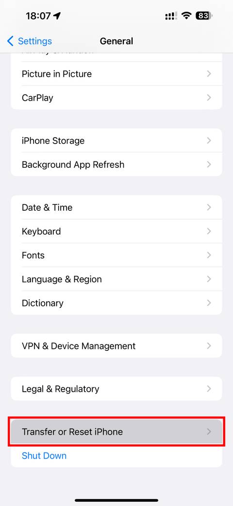 iOS 16.3 Settings app with the Transfer or Reset iPhone option highlighted
