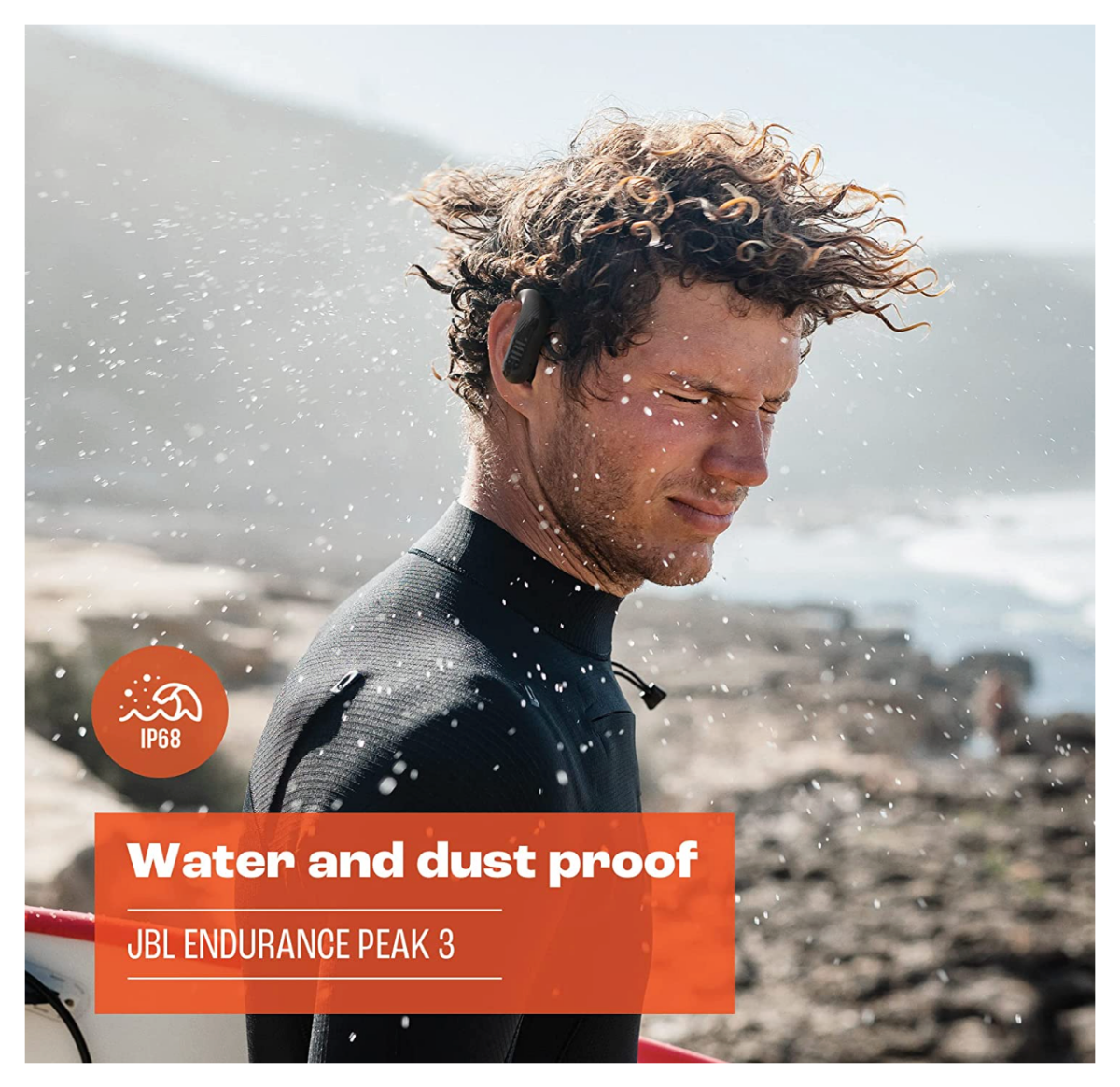 A surfer getting wet whil wearing the JBL Endurance Peak 3 earbuds