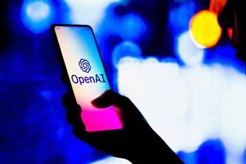 openai logo on smartphone being held feature