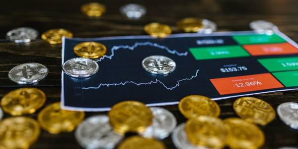 Selective Focus Photo of Silver and Gold Bitcoins